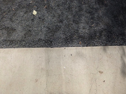 Transition from paved surface to compact gravel surface